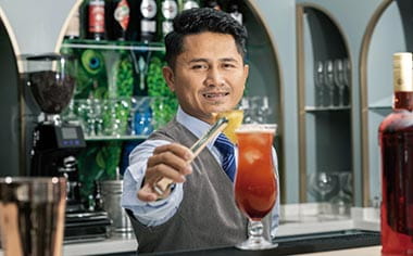 A cocktail being prepared in the Belvedere Lounge on Spirit of the Danube